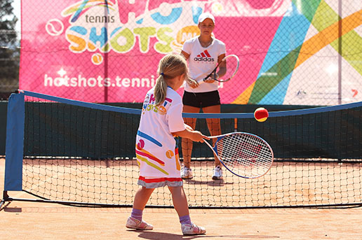 Ashleigh Barty on court with MLC Hot Shots