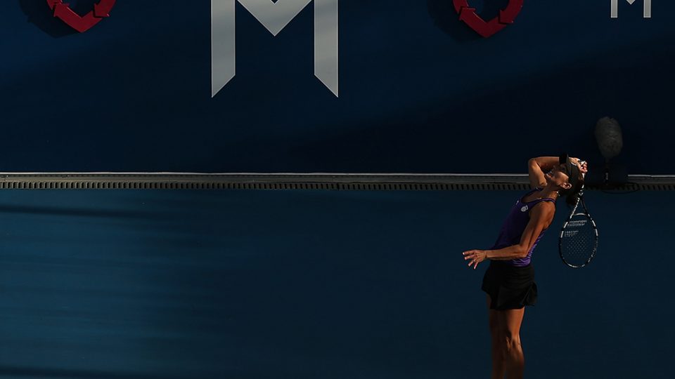 Chanelle Scheepers serves during the twilight match against Mona Barthel