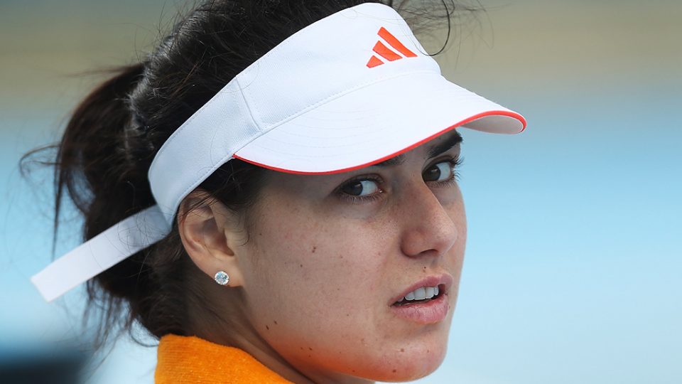 Sorana Cirstea watching on during her rain delayed match